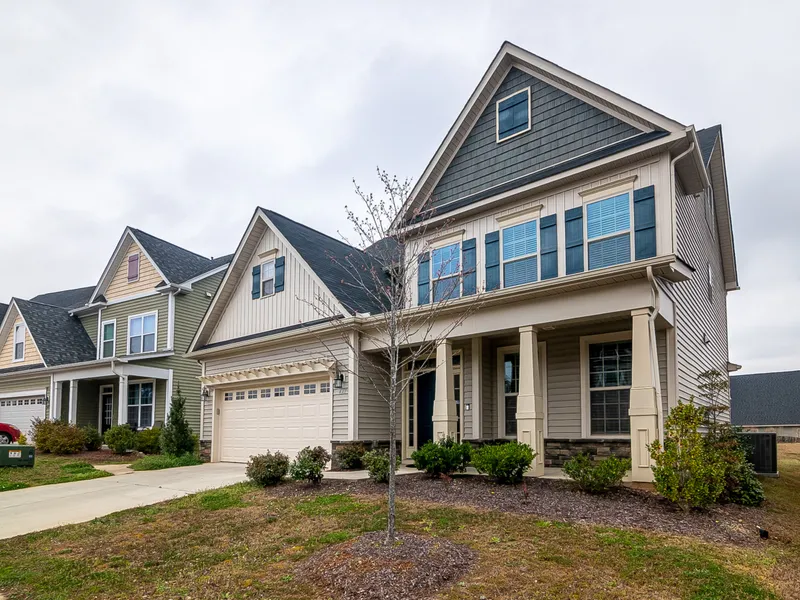 Craftsman-style two-story home with covered front porch, DFW real estate