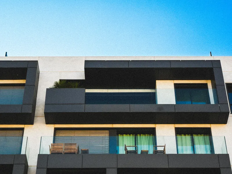 Contemporary building with dark cantilevered balconies, Texas real estate